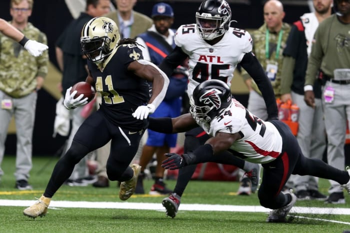 New Orleans Saints running back Alvin Kamara (41) avoids Falcons linebacker Foye Oluokun (54). Mandatory Credit: Chuck Cook-USA TODAY Sports